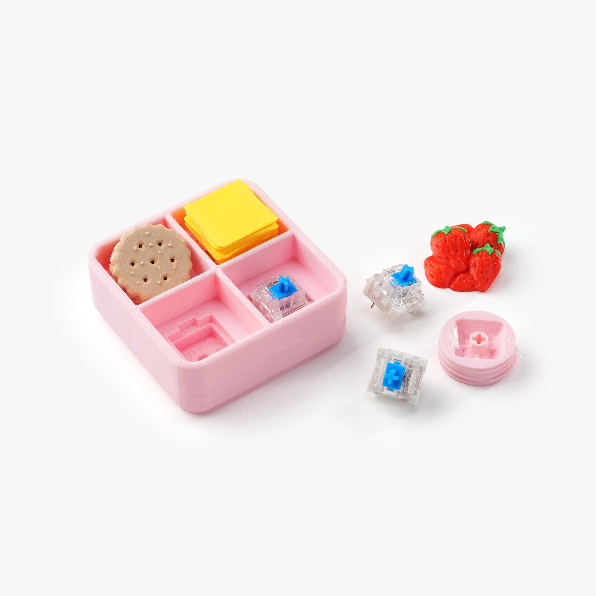 A pink compartment bento box set with miniature food accessories