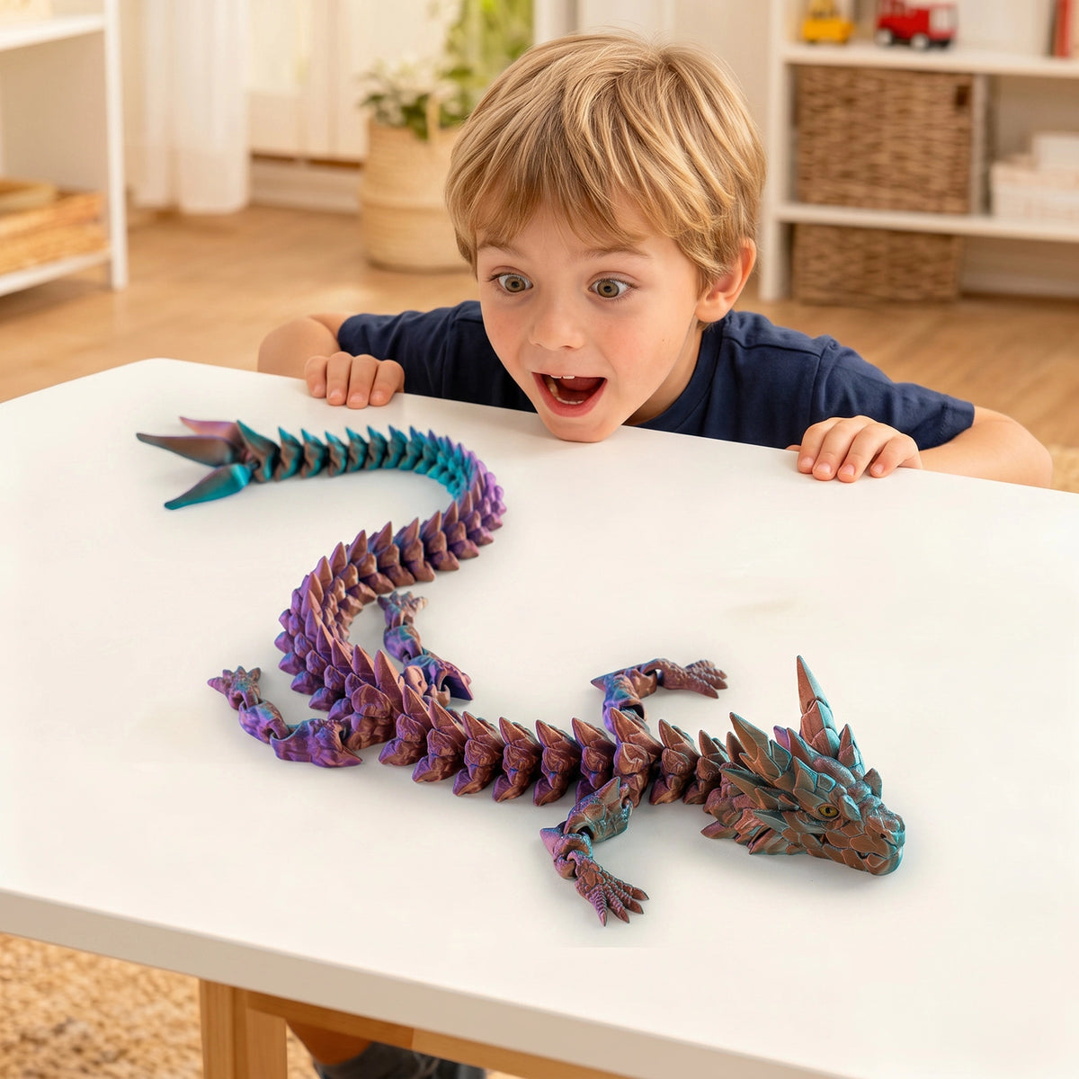 Boy playing with colorful 3D printed articulated Dragon