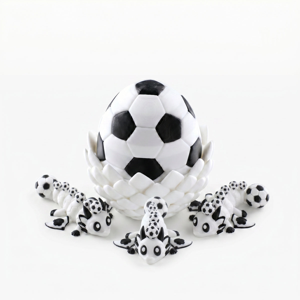 3D printed dragon egg with three articulated mini dragons