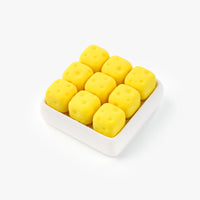 3D Printed Cheese Cube Fidget Toy in white tray