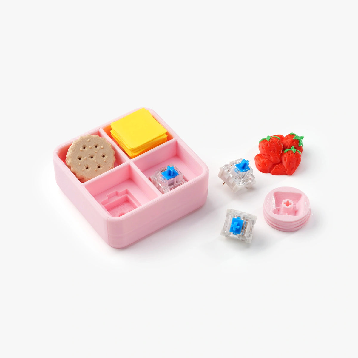 A pink compartment bento box set with miniature food accessories