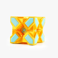 A yellow and light blue folding geometric toy, shown partially unfolded on a clean white background.