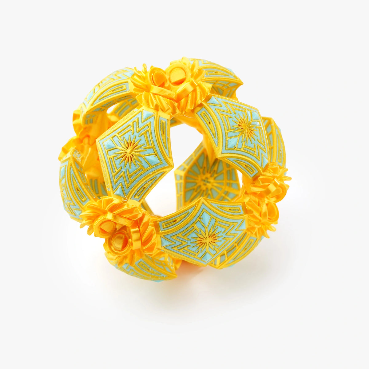 A yellow and light blue geometric interlocking ring-shaped ornament 