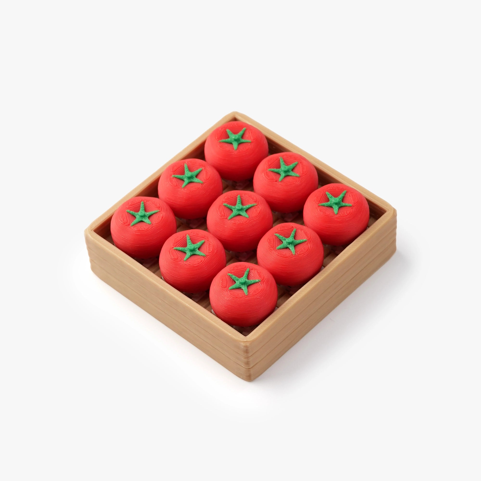Nine red tomato-shaped soap bars arranged in a square wooden tray on a clean white background.