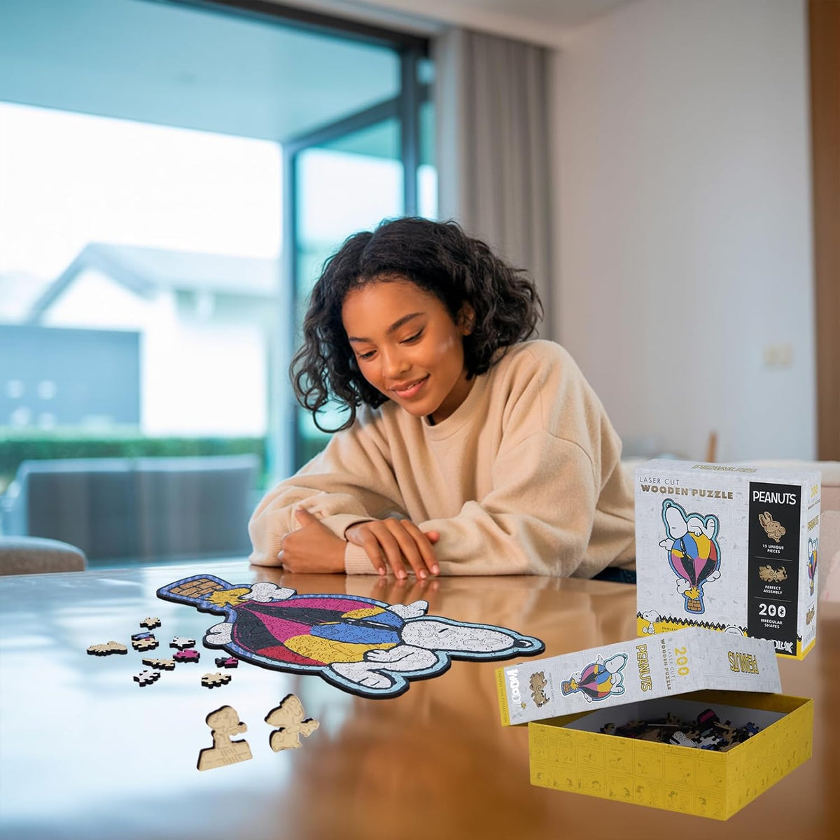 Woman assembling snoopy puzzle