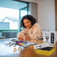 Woman assembling snoopy puzzle