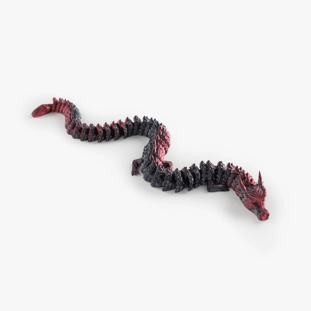 Flexed Nexbie 3D printed articulated dragon