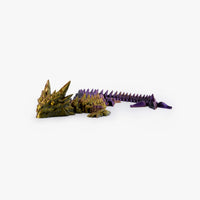 Side view of articulated dragon toy in matte finish