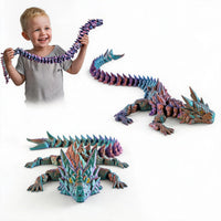 Boy playing with colorful 3D printed articulated Dragon