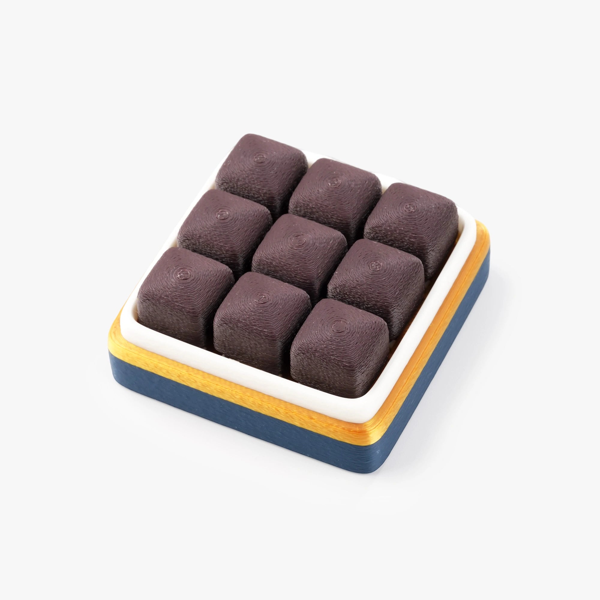 chocolates arranged in a square tray