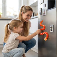 Kids using 3D Printed Love Snake Fridge Magnet on fridge