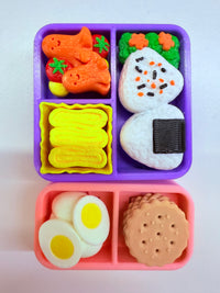 Two colorful plastic bento lunch boxes
